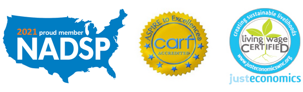 CARF and Living Wage Certified logos for disability programs and inclusive workforce